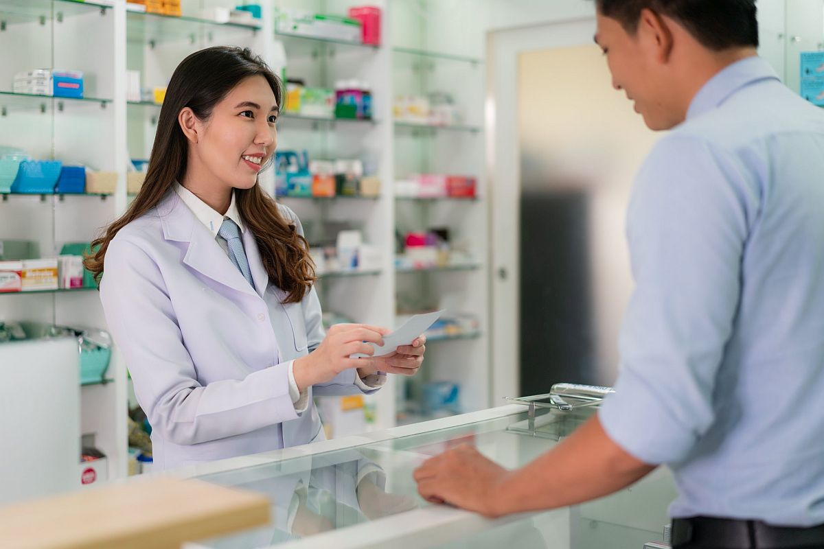 Customer speaking to pharmacist; distribution strategies concept