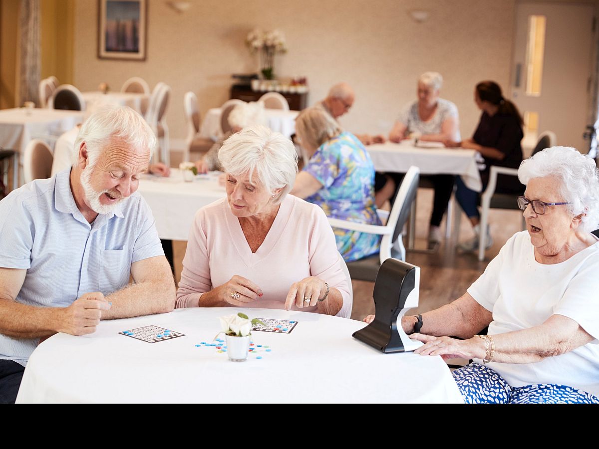 Group of older people playing bingo; rare disease communities concept