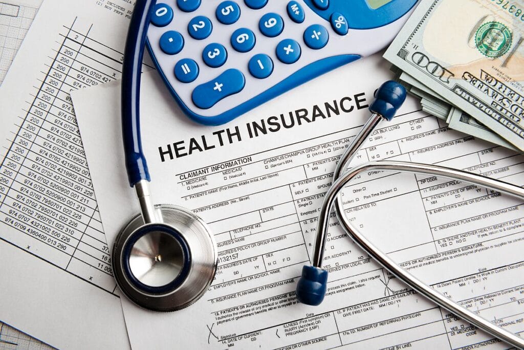 Health insurance application form with stethoscope; financial assistance rare disease concept