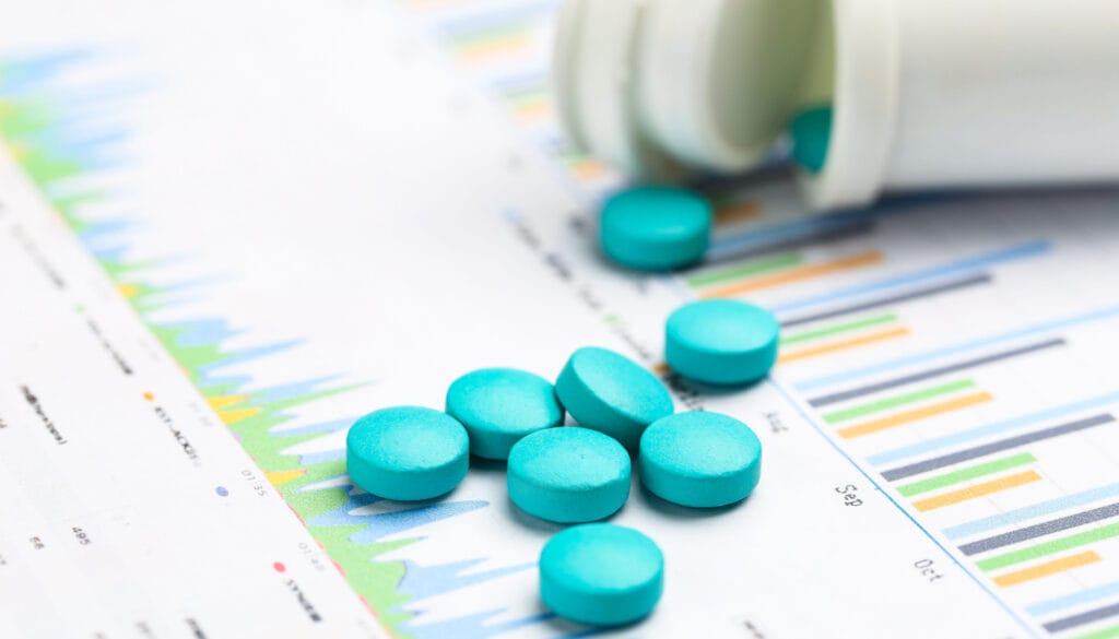 Close-up of pills on paper read-out; Specialty Pharma KPIs concept