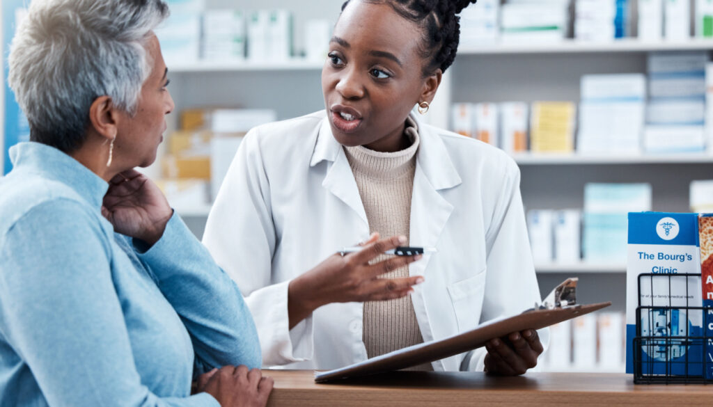 Pharmacist a customer in a dispensary; medication adherence strategies concept