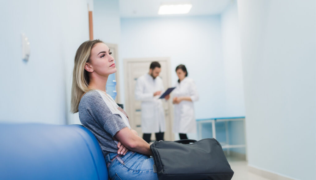 Woman patient waiting at hospital; medication adherence strategies concept